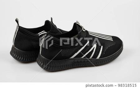 Black summer simple sneakers highlighted on a white background 98318515