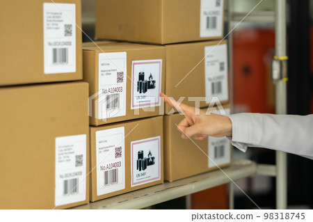 A woman taking inventory No face A woman taking inventory No face 98318745