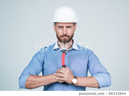 The right solutions. boss on construction site. repair and fix. labor day. mature bearded businessman in helmet. confident guy hold hammer. business project engineer. male worker in hard hat 98318844