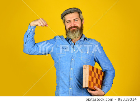 Teacher chess competition. Board game. Man playing chess. Chess figures. Intellectual games. Intelligent bearded hipster. Cognitive skills. Game strategy concept. Chess lesson. Exercise for brain Teacher chess competition. Board game. Man playing chess. Chess figures. Intellectual games. Intelligent bearded hipster. Cognitive skills. Game strategy concept. Chess lesson. Exercise for brain 98319014
