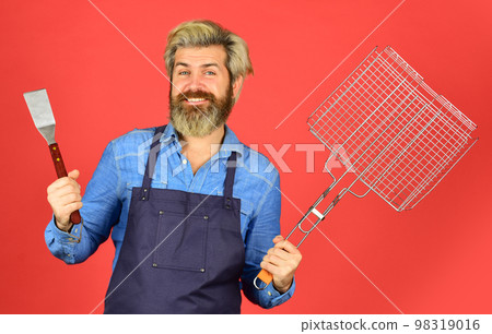 Bbq party. Culinary concept. summer weekend. happy hipster hold cooking utensils for barbecue. bearded man chef. Tools for roasting meat outdoors. Picnic and barbecue. ready for barbecue party Bbq party. Culinary concept. summer weekend. happy hipster hold cooking utensils for barbecue. bearded man chef. Tools for roasting meat outdoors. Picnic and barbecue. ready for barbecue party 98319016