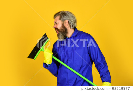 i love singing. sweeping the floor. man cleaner. bearded man cleaning with mop. Janitor in gloves. husband cleaning house. Housework and domestic duty. Male janitor with cleaning supply 98319577