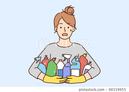 Stressed woman with detergent bottles 98319955