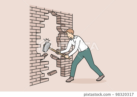 Businessman with hammer break wall Businessman with hammer break wall 98320317