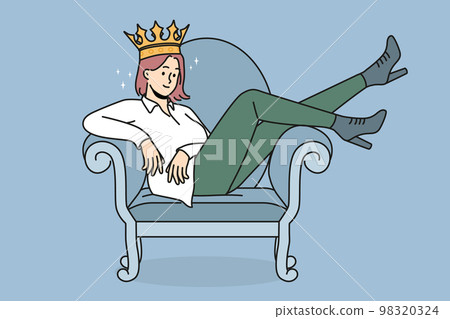 Confident woman in crown sitting on chair Confident woman in crown sitting on chair 98320324