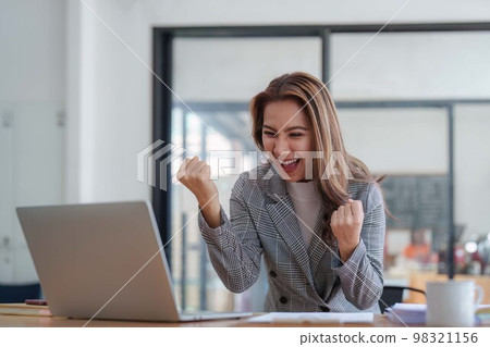 Portrait of Happy asian business woman with laptop computer in office. Woman in suit at office 98321156