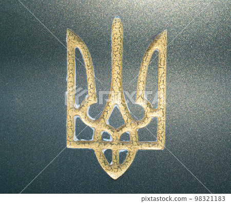 Golden coat of arms of Ukraine Trident on green marble. 98321183