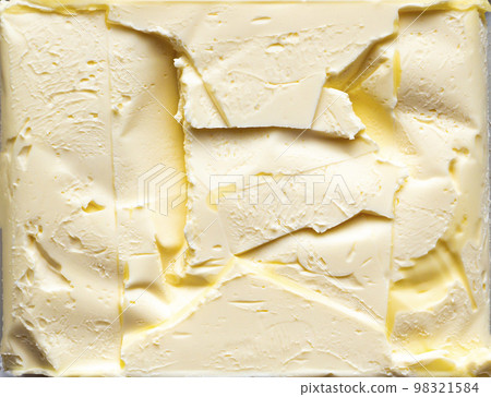 The texture of the surface of the butter with the impression of the packaging. The texture of the surface of the butter with the impression of the packaging. 98321584