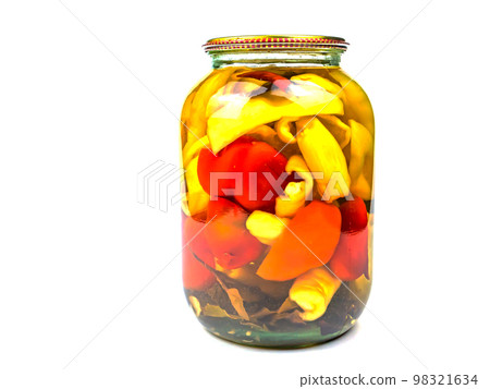 Canned Bulgarian pepper vegetable in a glass jar. 98321634