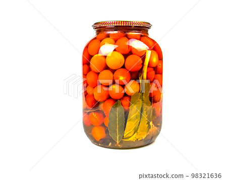 Canned tomato vegetable in a glass jar. Canned tomato vegetable in a glass jar. 98321636