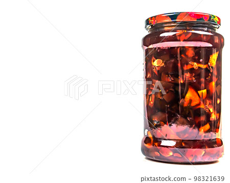 Canned fruits and vegetables in glass jars. 98321639