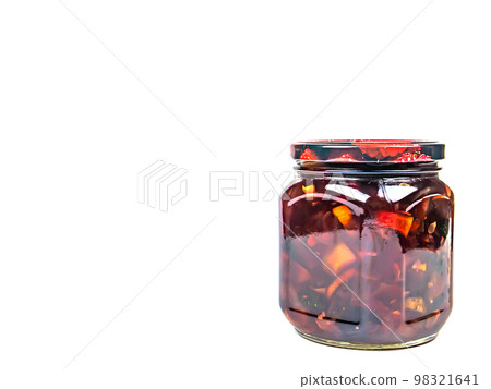 Canned fruits and vegetables in glass jars. 98321641