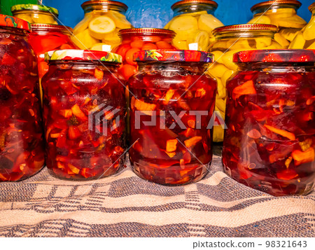 Canned fruits and vegetables in glass jars. Canned fruits and vegetables in glass jars. 98321643