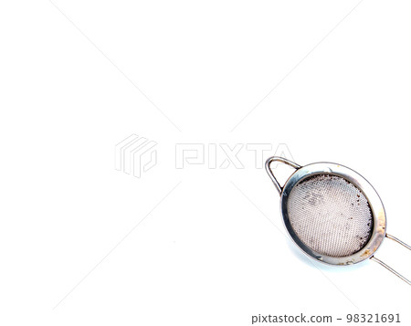 Metal strainer for coffee and tea on a white background. 98321691