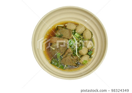 boiled braised beef and meatball in black herb soup on bowl boiled braised beef and meatball in black herb soup on bowl 98324349