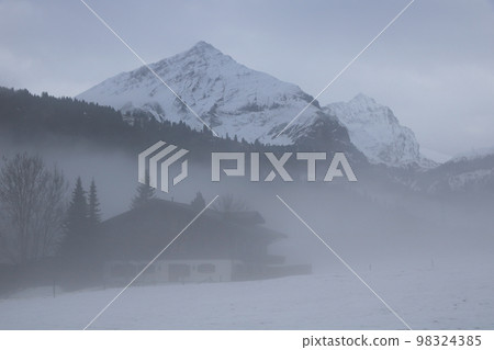 Misty winter morning in the Saanenland Valley. Misty winter morning in the Saanenland Valley. 98324385