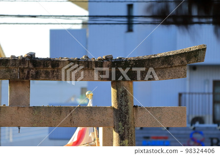 Wishing stone above the torii image 98324406