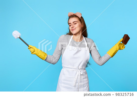 woman in rubber gloves and cleaner apron cleaning with sponge 98325716