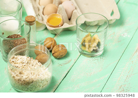 Ingredients for making oatmeal cookies on the table. Homemade oatmeal cookies Ingredients for making oatmeal cookies on the table. Homemade oatmeal cookies 98325948