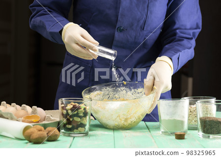 Cooking oatmeal cookies with nuts and candied fruit sweet nutritious dessert Cooking oatmeal cookies with nuts and candied fruit sweet nutritious dessert 98325965