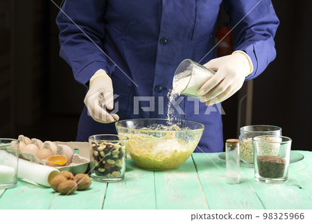 Cooking oatmeal cookies with nuts and candied fruit sweet nutritious dessert Cooking oatmeal cookies with nuts and candied fruit sweet nutritious dessert 98325966