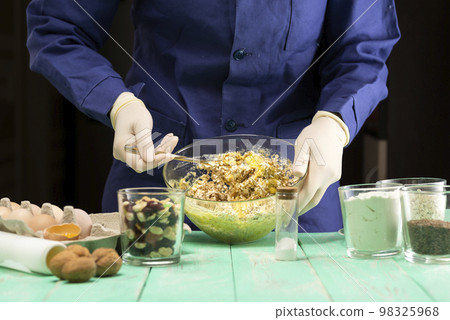 Cooking oatmeal cookies with nuts and candied fruit sweet nutritious dessert 98325968