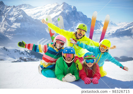 Family in winter mountains. Ski and snow vacation. 98326715