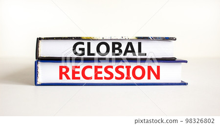 Global recession symbol. Concept words Global recession on books. Beautiful white table white background. Business and global recession concept. Copy space. Global recession symbol. Concept words Global recession on books. Beautiful white table white background. Business and global recession concept. Copy space. 98326802