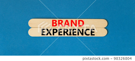 Brand experience symbol. Concept words Brand experience on wooden stick. Beautiful blue table blue background. Business branding and brand experience concept. Copy space. 98326804