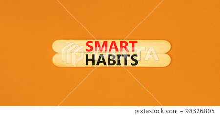 Smart habits symbol. Concept words Smart habits on wooden stick. Beautiful orange table orange background. Business and smart habits concept. Copy space. Smart habits symbol. Concept words Smart habits on wooden stick. Beautiful orange table orange background. Business and smart habits concept. Copy space. 98326805