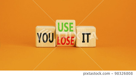You use or lose it symbol. Concept word You use or lose it on wooden cubes. Beautiful orange table orange background. Business and TYou use or lose it concept. Copy space. You use or lose it symbol. Concept word You use or lose it on wooden cubes. Beautiful orange table orange background. Business and TYou use or lose it concept. Copy space. 98326808