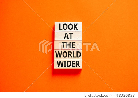 Look at the world wider symbol. Concept words Look at the world wider on wooden blocks on a beautiful orange table orange background. Business and look at the world wider concept. Copy space. Look at the world wider symbol. Concept words Look at the world wider on wooden blocks on a beautiful orange table orange background. Business and look at the world wider concept. Copy space. 98326858