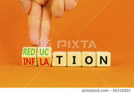 Inflation or reduction symbol. Concept word Inflation Reduction on wooden cubes. Businessman hand. Beautiful orange table orange background. Business inflation or reduction concept. Copy space. Inflation or reduction symbol. Concept word Inflation Reduction on wooden cubes. Businessman hand. Beautiful orange table orange background. Business inflation or reduction concept. Copy space. 98326891