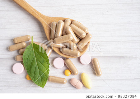 Alternative medicine herbal organic capsule with vitamin E omega 3 fish oil, mineral, drug with herbs leaf natural supplements for healthy good life. 98327084