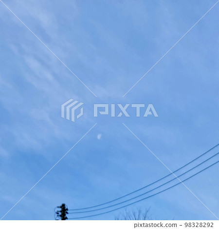 A sky with thin cotton-like clouds gently enveloping the moon A sky with thin cotton-like clouds gently enveloping the moon 98328292
