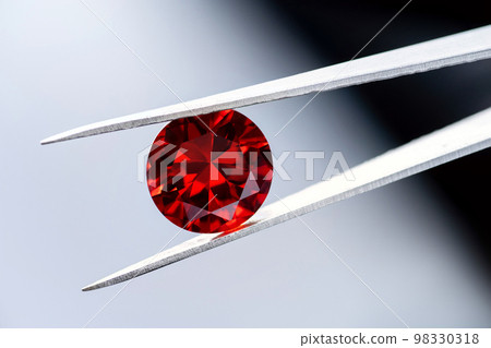 Red Ruby gemstone Round Cut isolate on white background, close up shot 98330318