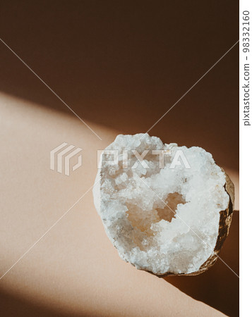 Druze of crystals quartz on beige background with shadows 98332160