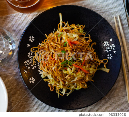 Japanise style noodles with vegetables yakisoba beautifully served in the bowl Japanise style noodles with vegetables yakisoba beautifully served in the bowl 98333028