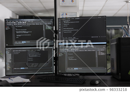 Computer monitors on desk compiling programming html data algorithms in empty software company. Database network servers cloud computing in it agency room, code script language. Computer monitors on desk compiling programming html data algorithms in empty software company. Database network servers cloud computing in it agency room, code script language. 98333218