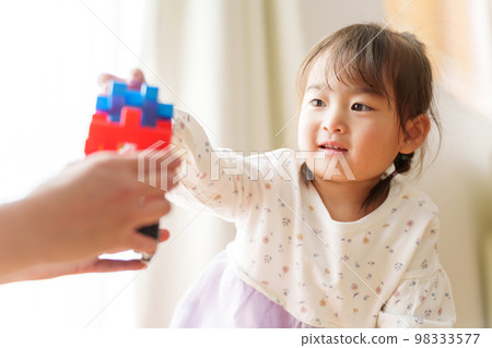 girl and mother playing with toys girl and mother playing with toys 98333577
