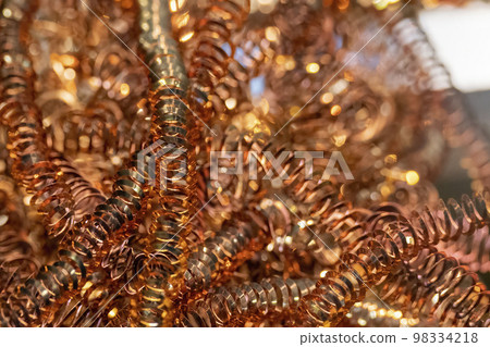 Close-up scene of brass materials scrap from turning process. Close-up scene of brass materials scrap from turning process. 98334218