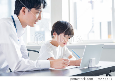 Boy studying at a cram school Boy studying at a cram school 98334525