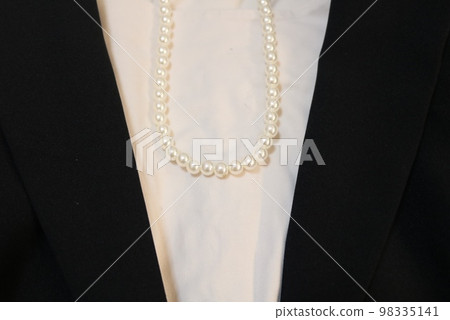 Formal suit and pearl necklace Formal suit and pearl necklace 98335141