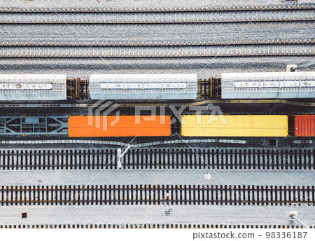 Top down view colorful wagons standing still parked on the railway lines  98336187