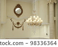 A room with a chandelier 98336364
