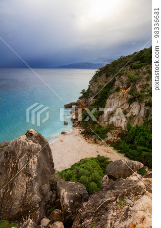 Sandy Beach on a rocky coast near Cala Gonone, Sardinia. 98336681