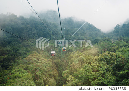 View of Ba Na Hills Mountain in the fog from Cable car. Landmark and popular. Da Nang, Vietnam and Southeast Asia travel concept View of Ba Na Hills Mountain in the fog from Cable car. Landmark and popular. Da Nang, Vietnam and Southeast Asia travel concept 98338288