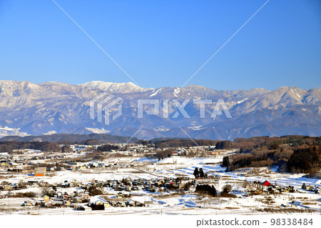 Around Kurokawa, Iizuna Town and Mure, Iizuna Town (front) / Looking toward Shiga Kogen (distant view) (Iizuna Town, Nagano Prefecture) [January 2023] 98338484