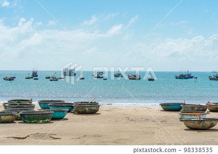 Basket boats at My Khe beach in Da Nang city, Vietnam. Local fishing boats of Danang have become iconic to Vietnam. Southeast Asia travel concept 98338535
