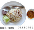 Hainanese chicken rice served on a plate with dipping sauce 98339764